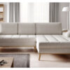 Nub corner sofa bed with wooden legs and built-in side shelves in a Scandinavian living room.