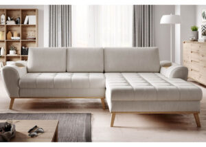 Nub corner sofa bed with wooden legs and built-in side shelves in a Scandinavian living room.