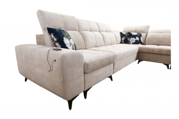 GOLDEN XI corner sofa with its sleeping function extended, showing comfortable bed