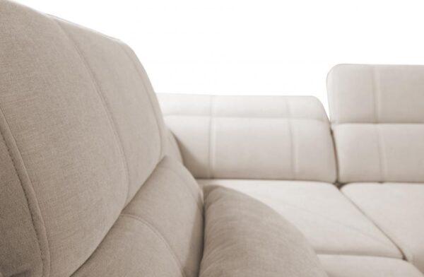 Detailed shot of RAVELLO VI's decorative cushions and quality fabric upholstery.