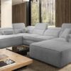 VITO VI corner sofa with a person relaxing, illustrating comfort and spaciousness