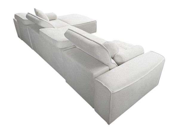Detail of VITO XII MIX corner sofa's extendable footrest mechanism, comfort focus