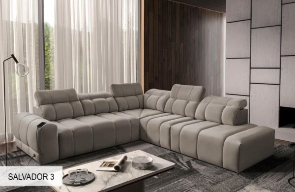 AVELIO IX corner sofa demonstrating an adjustable headrest in use.