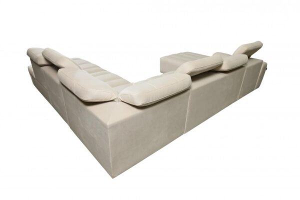 AVELIO X corner sofa with a functional chaise longue and pouffe arrangement.